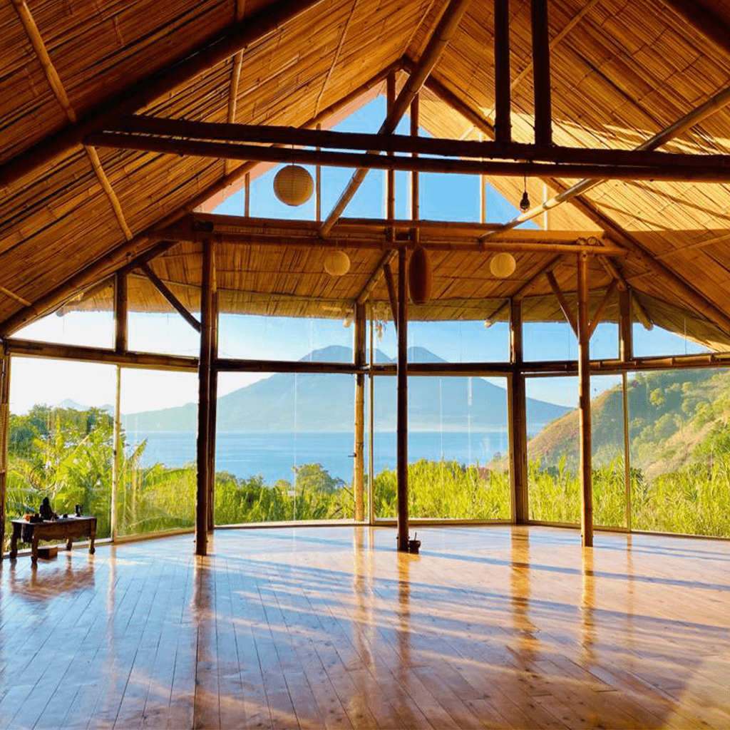 An empty wooden shala, quiet and open to the lake.
