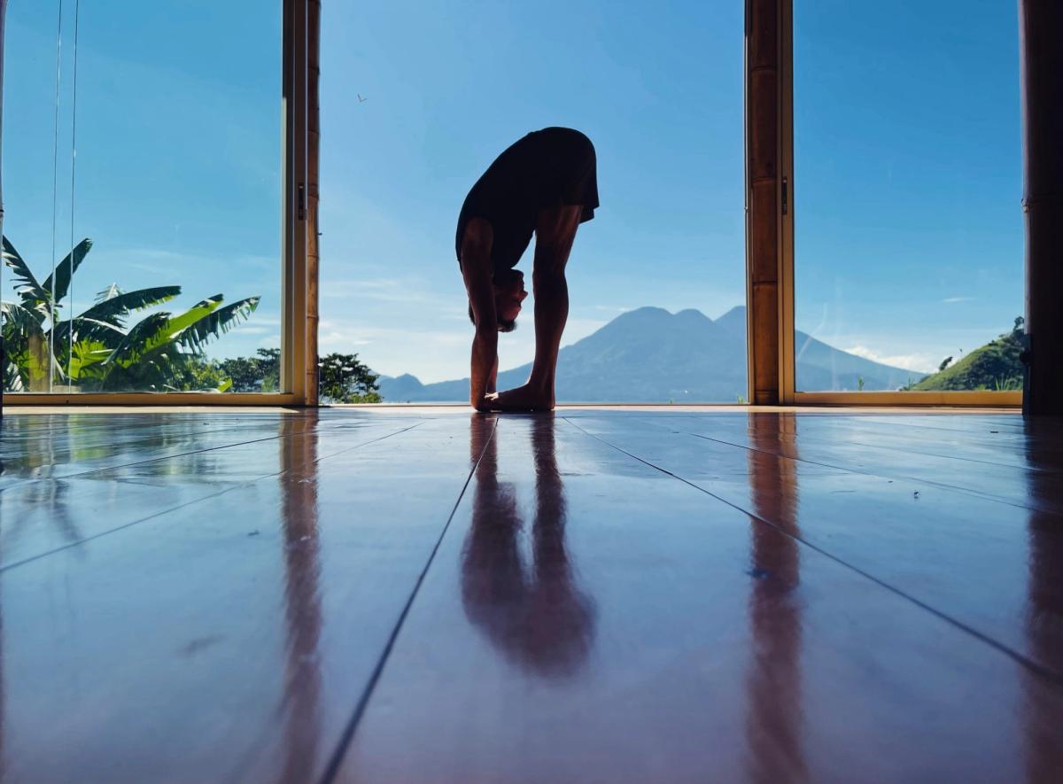 A standing forward fold in a shala, with the volcano behind.