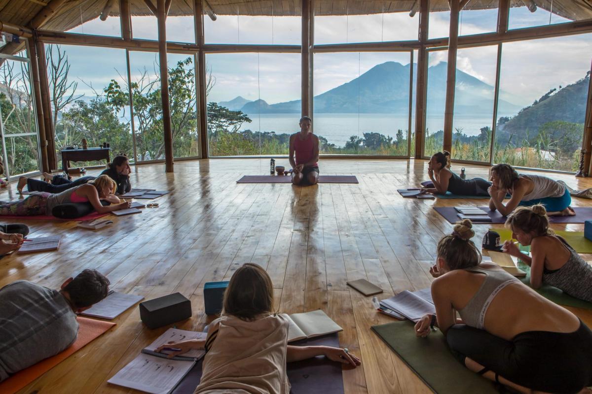 A Mysore-style room with students practicing.