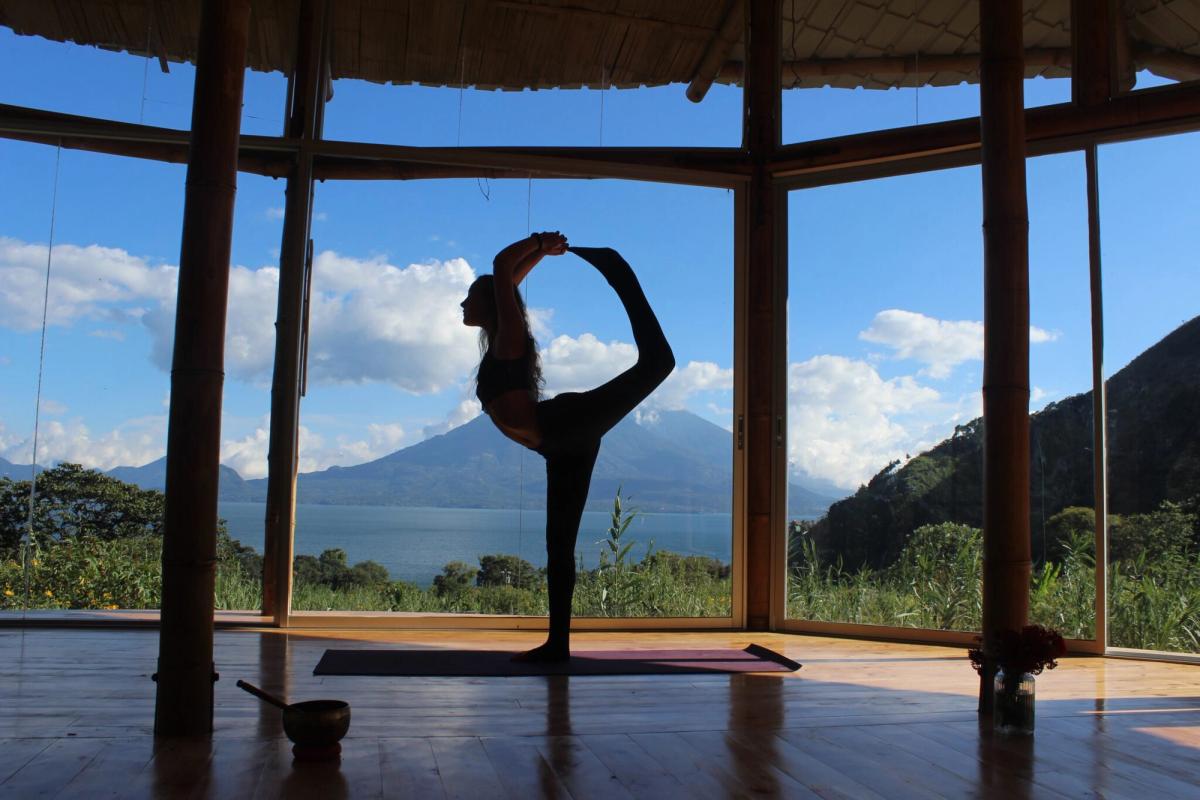 Natarajasana, a standing balance, with the lake behind.