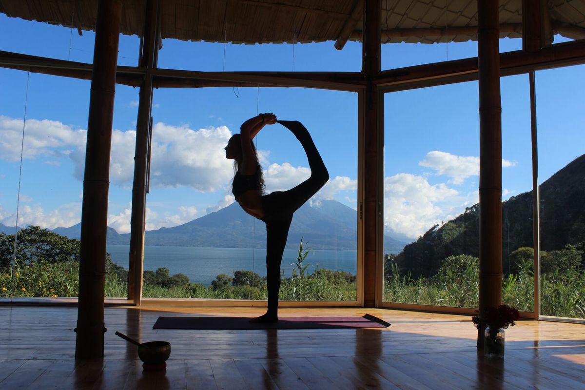 Natarajasana, a standing balance, with the lake behind.