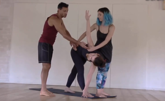 Hands-on assist in revolved triangle