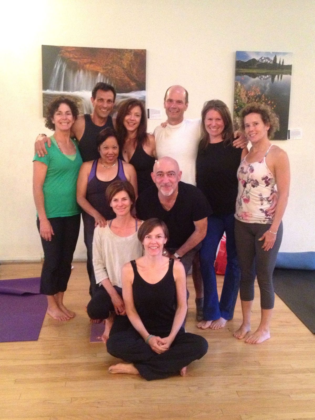 A group of yoga students together indoors.