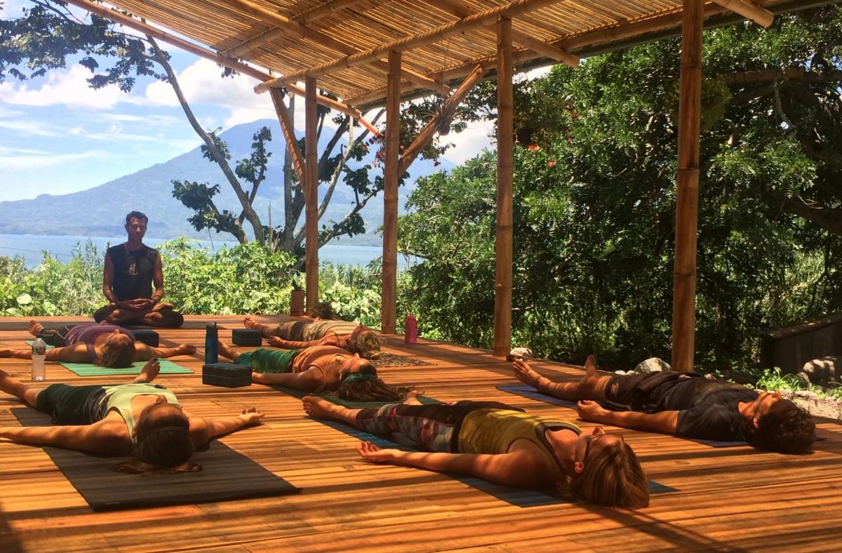 A class resting in Savasana.