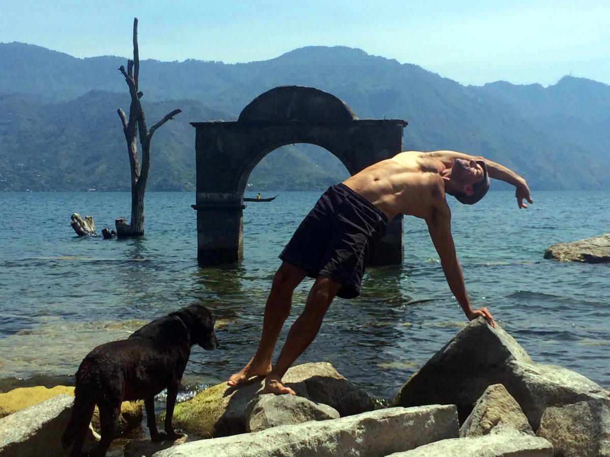 A side bend beside the lake, a dog nearby.