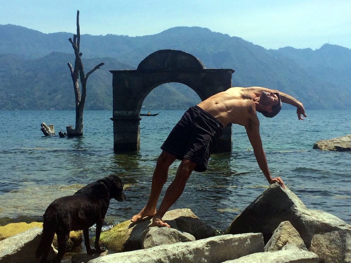 A side bend beside the lake, a dog nearby.