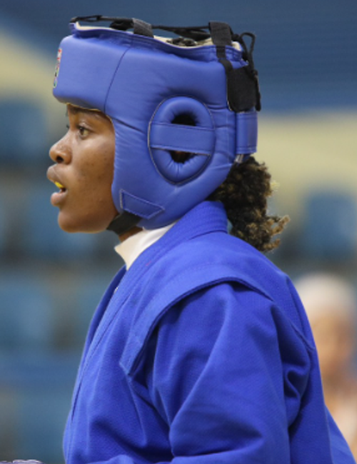 Headshot portrait of Cameroonian boxer Marie-Victorine Onguene Tsimi in sports gear