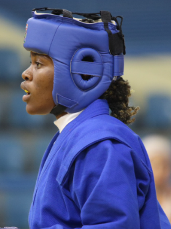 Headshot portrait of Cameroonian boxer Marie-Victorine Onguene Tsimi in sports gear