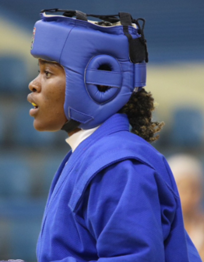 Headshot portrait of Cameroonian boxer Marie-Victorine Onguene Tsimi in sports gear