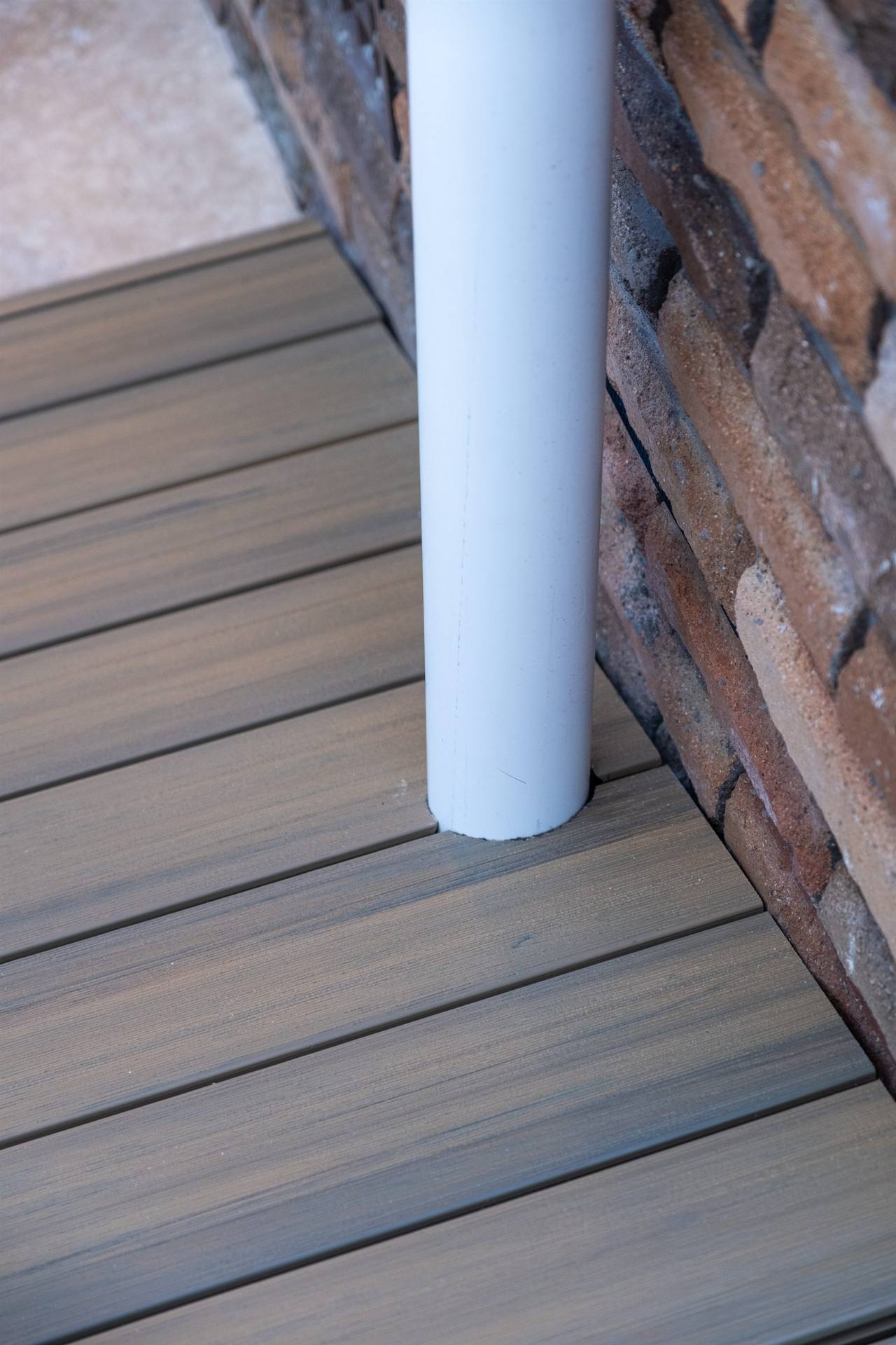 Bexley deck post detail — composite timber decking against face brick