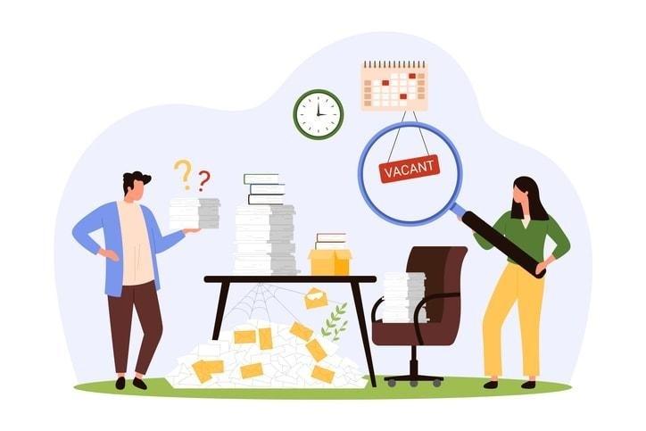 A group of technology professionals is collaborating in a modern office space filled with multiple screens, showcasing an engaging company culture. This environment supports both active job seekers and passive candidates, highlighting the recruitment strategy aimed at attracting the best talent for open positions.