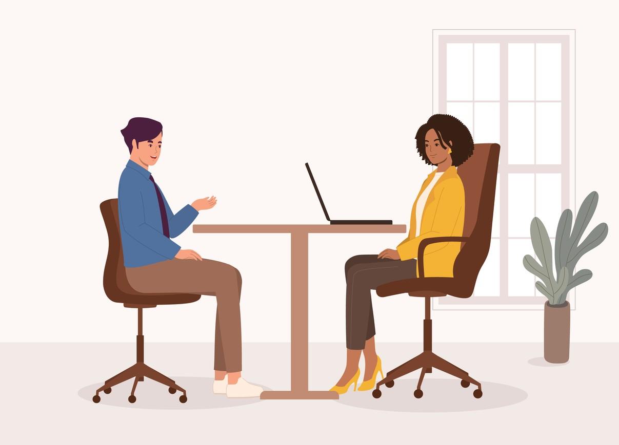 Candidate confidently responding to a tough interview question in a professional setting.