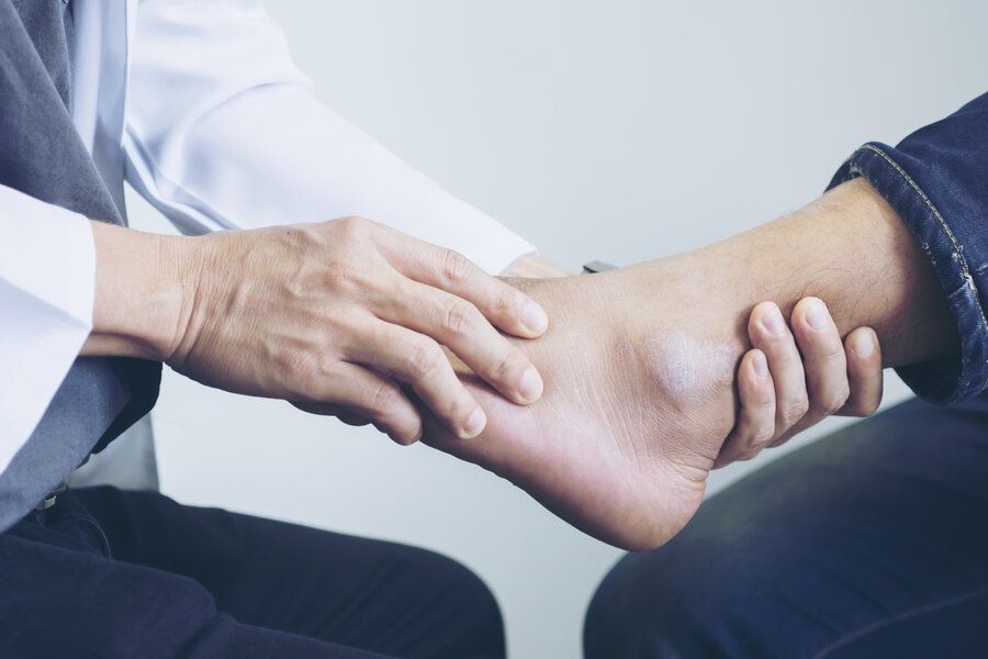 Highly rated foot doctor in Beverly Hills examines woman's foot