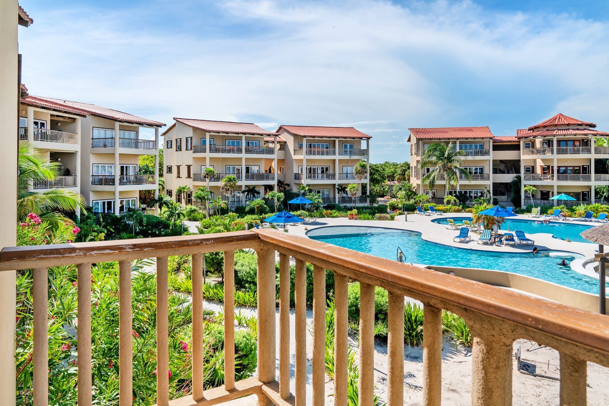 Balcony view over the resort pool and beach