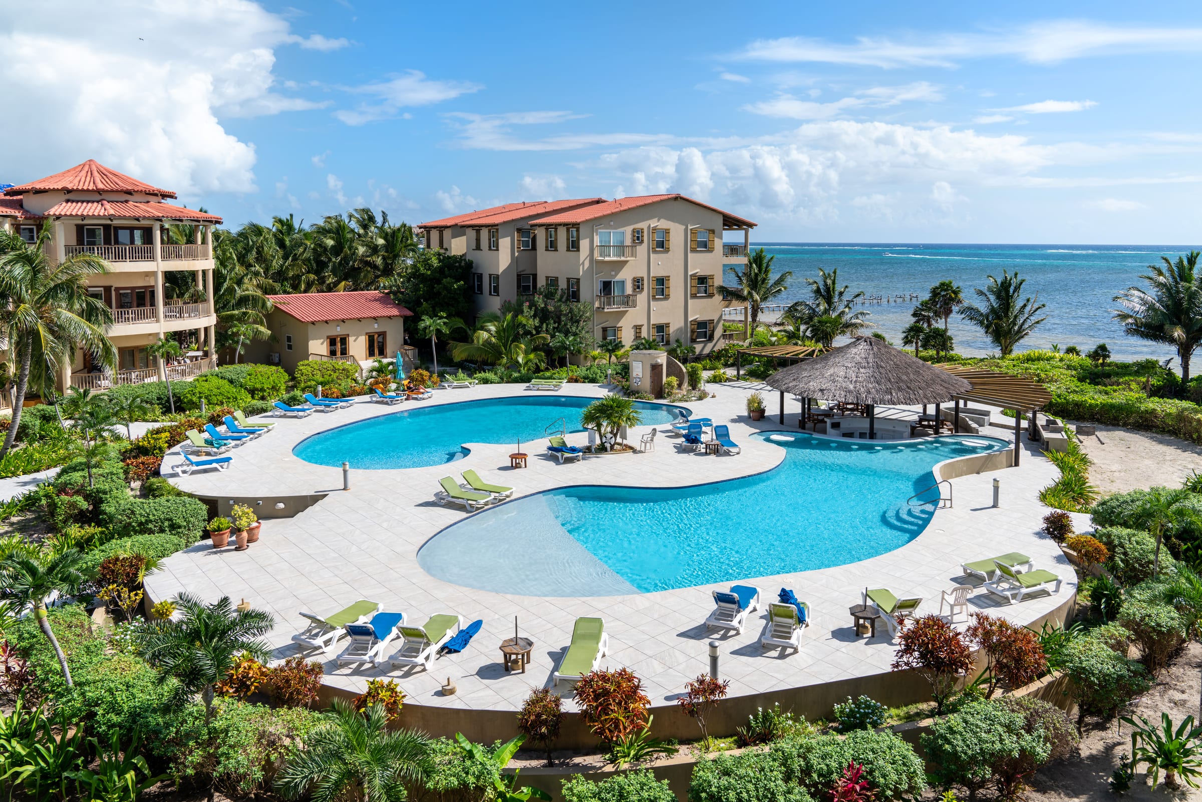 Aerial view of the resort pools and oceanfront buildings
