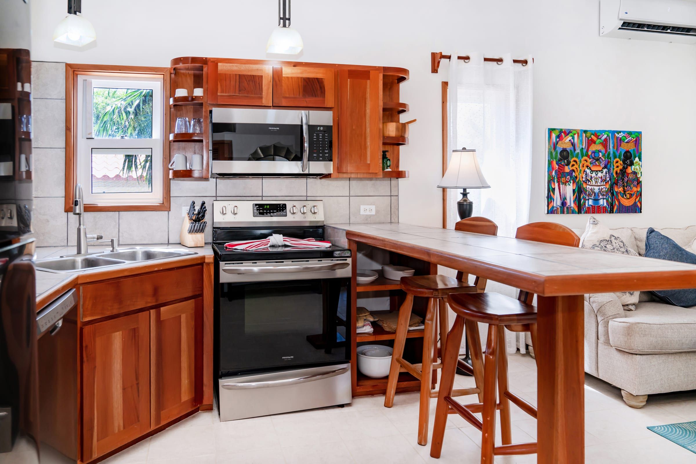 Kitchen with a stainless steel range and a breakfast bar