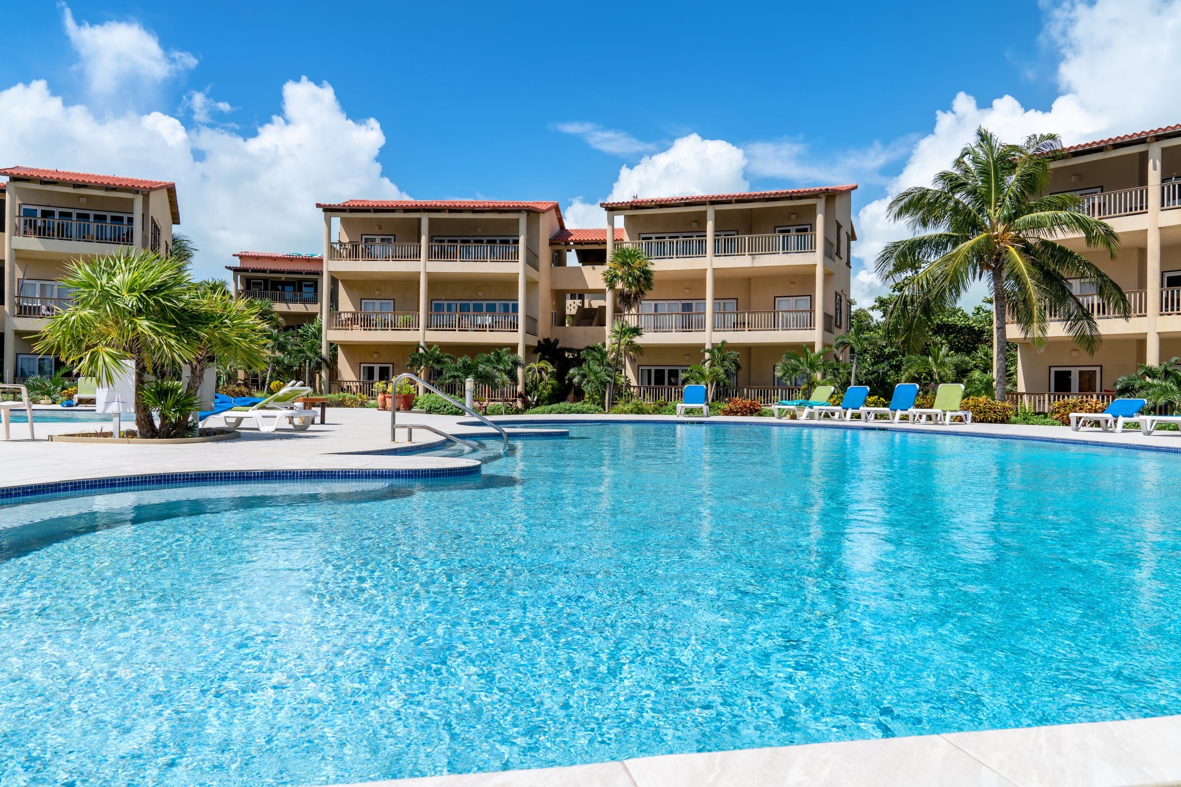 Resort pool with three-story oceanfront buildings