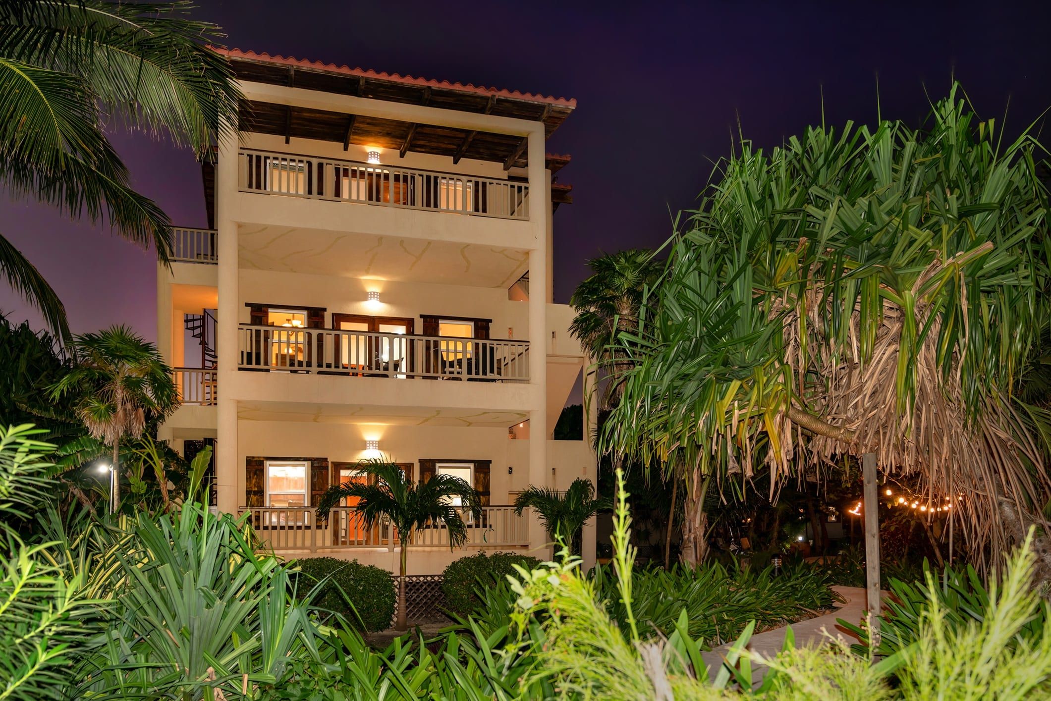Three-story resort building lit up at night