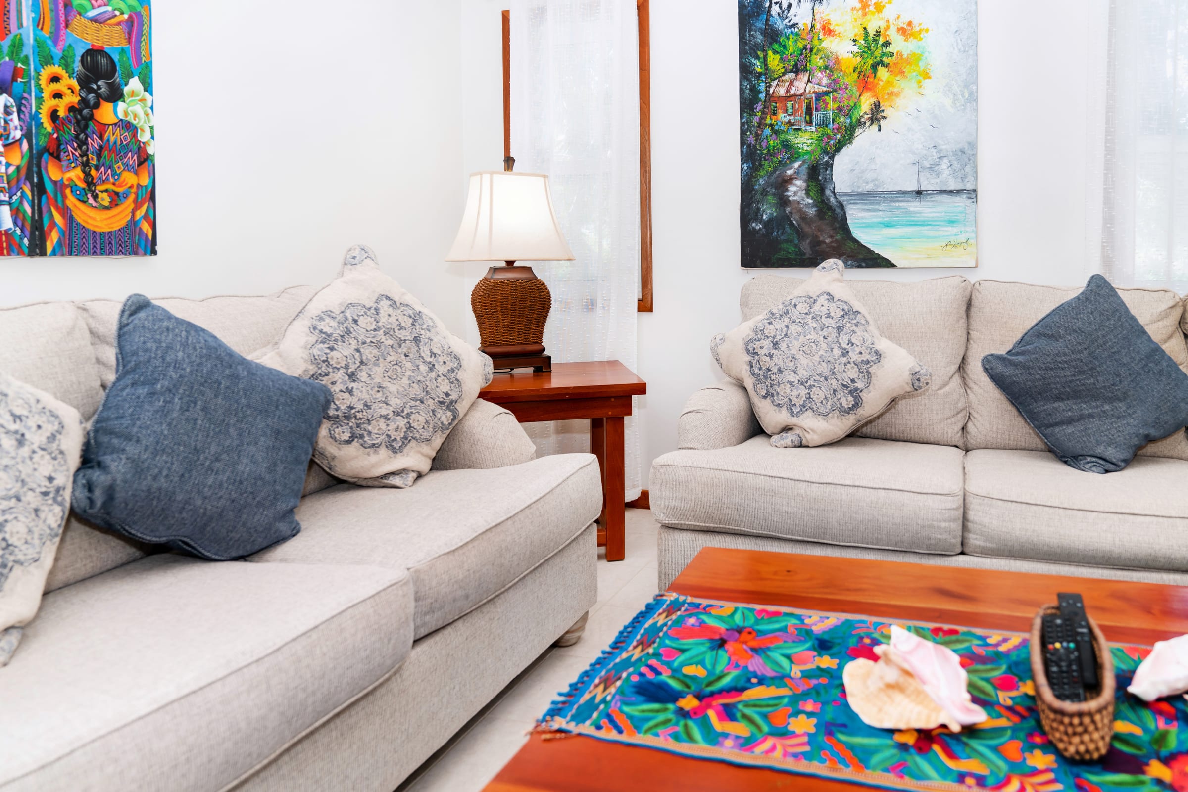 Sofa and a colorful runner on the coffee table