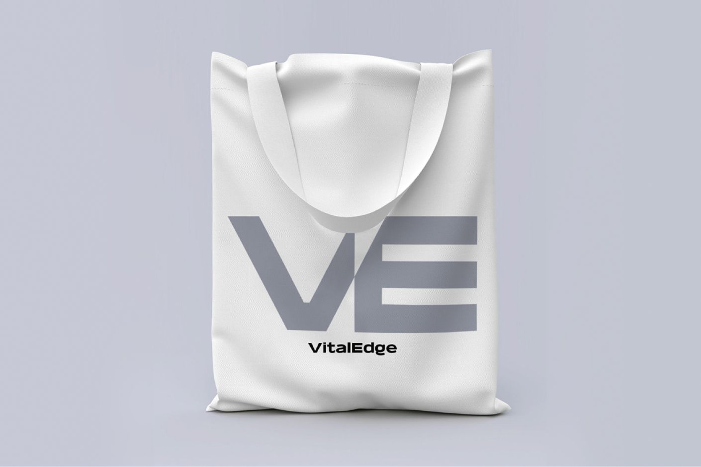 White tote bag printed with the VitalEdge VE mark