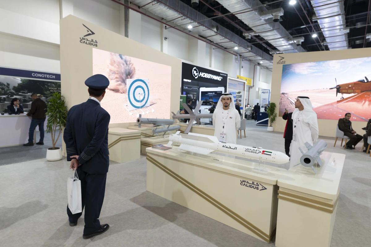 Custom exhibition stand with enclosed private meeting area designed for VIP military delegations
