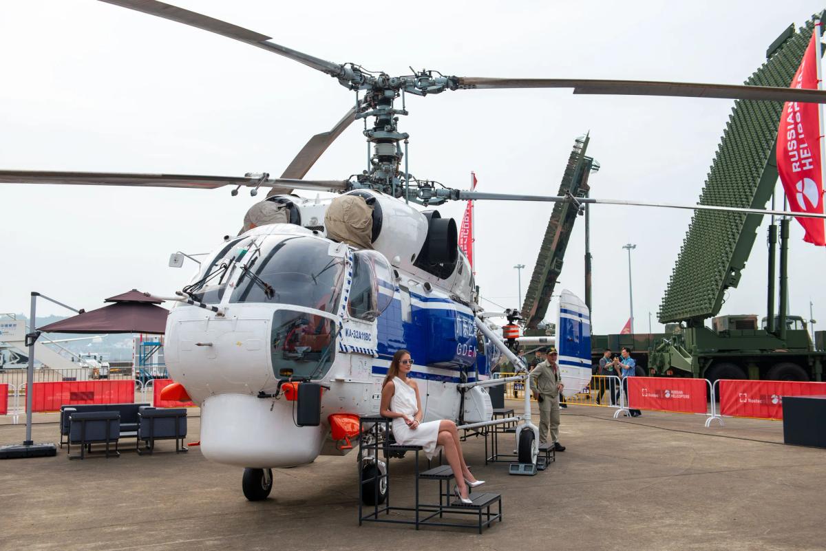 Chinese aerospace exhibition stand featuring enclosed meeting areas and branded hospitality zones
