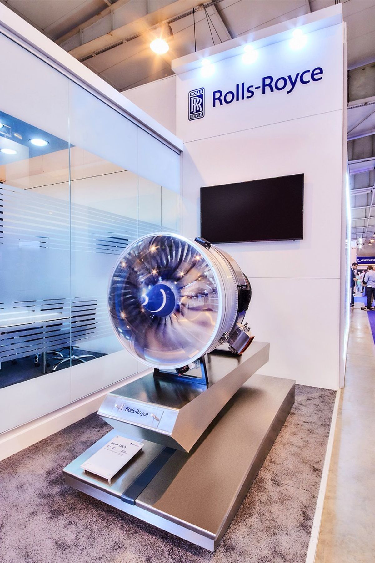 A Rolls-Royce Trent aero engine displayed on a custom-built exhibition stand