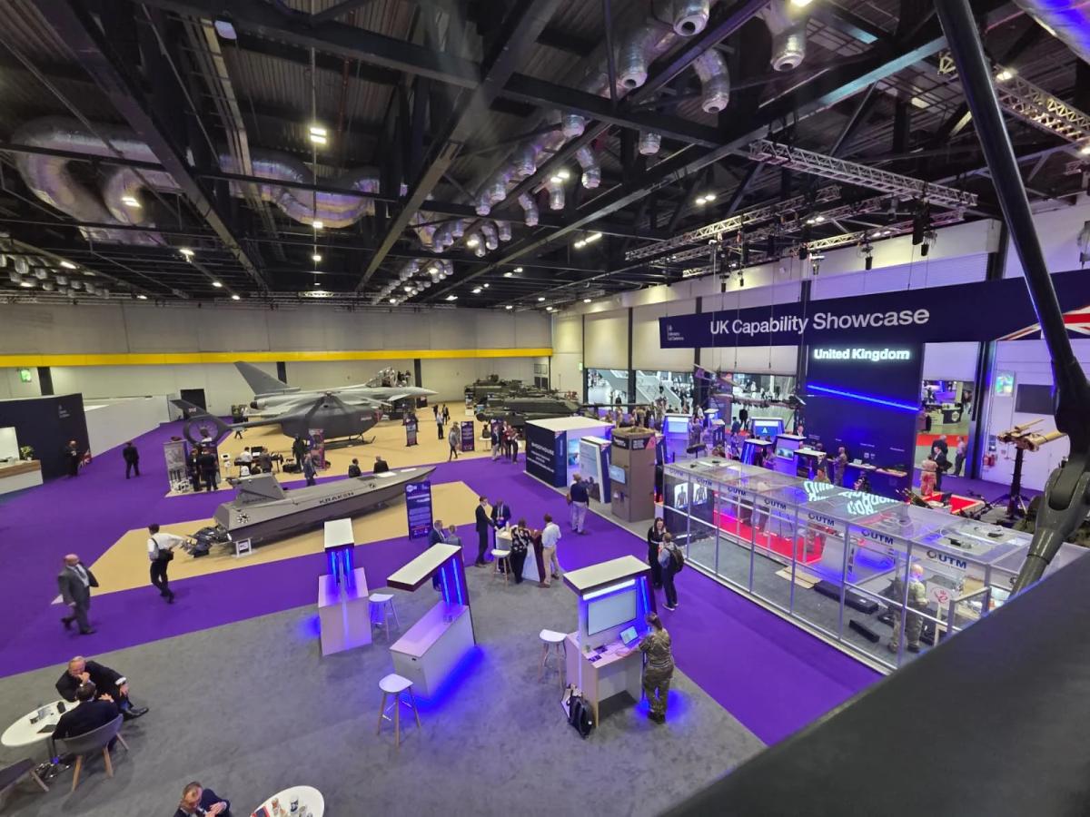 Custom defence exhibition stand featuring enclosed VIP meeting areas for military delegation discussions
