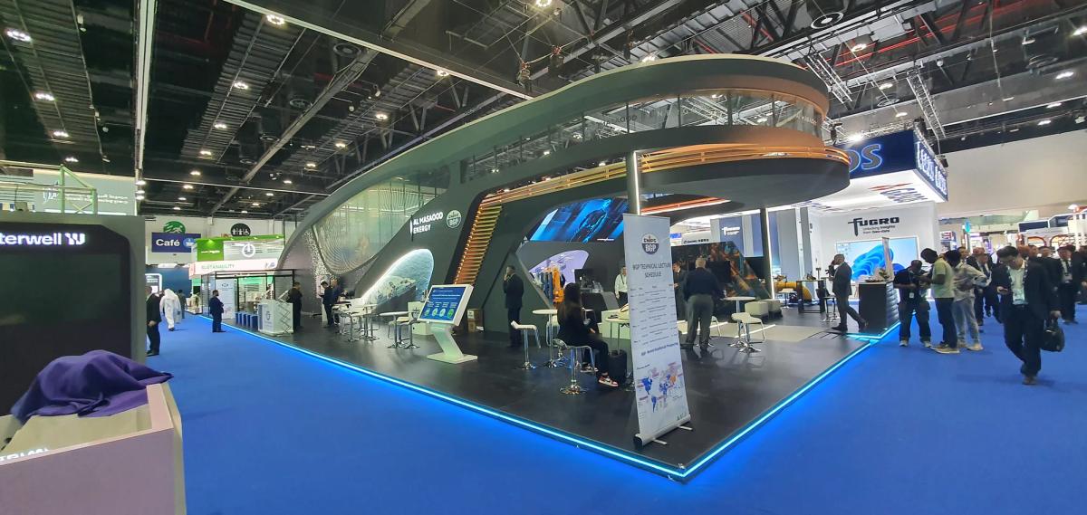 Large-scale industrial technology exhibition stand with modern architecture and meeting areas