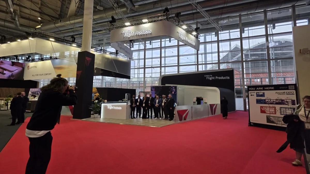 A custom Aircraft Interiors exhibition stand with the exhibitor team on the show floor