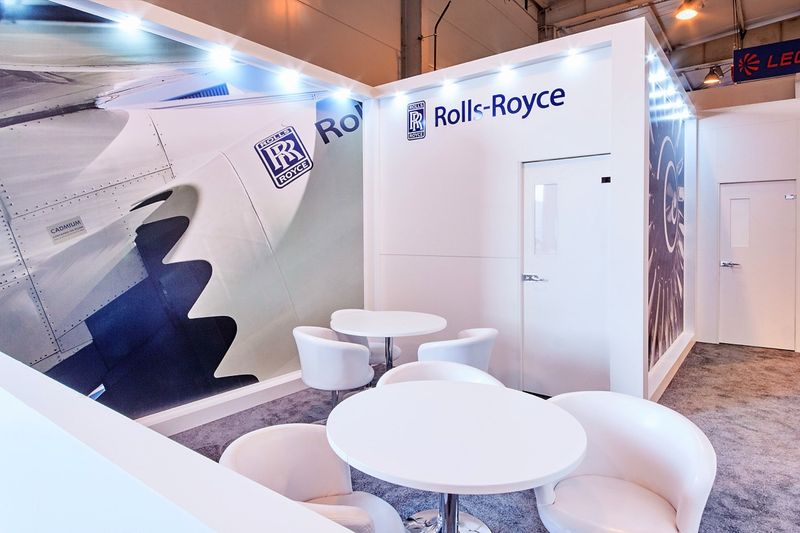 Rolls-Royce exhibition stand with meeting tables and a private room, built by Orchestra Media