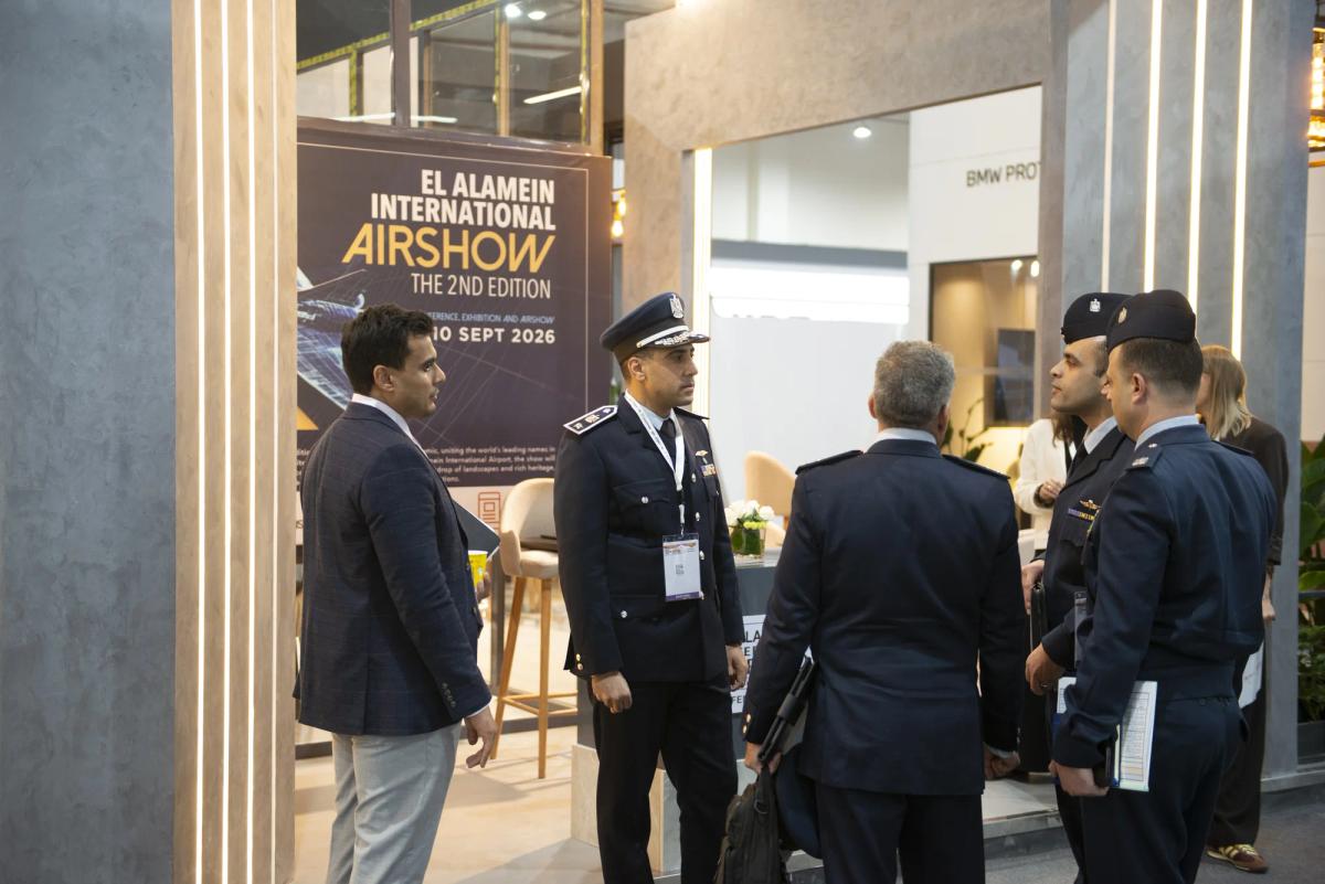 Large international defence exhibition floor with custom stands and industry visitors