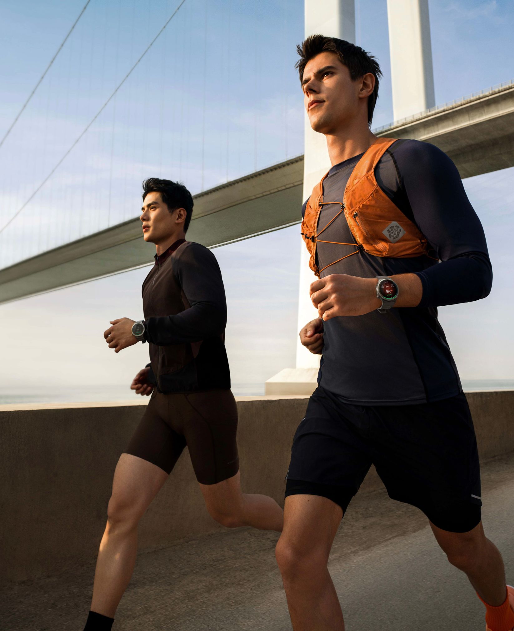 Three OPPO Watch models in pink, orange and grey
