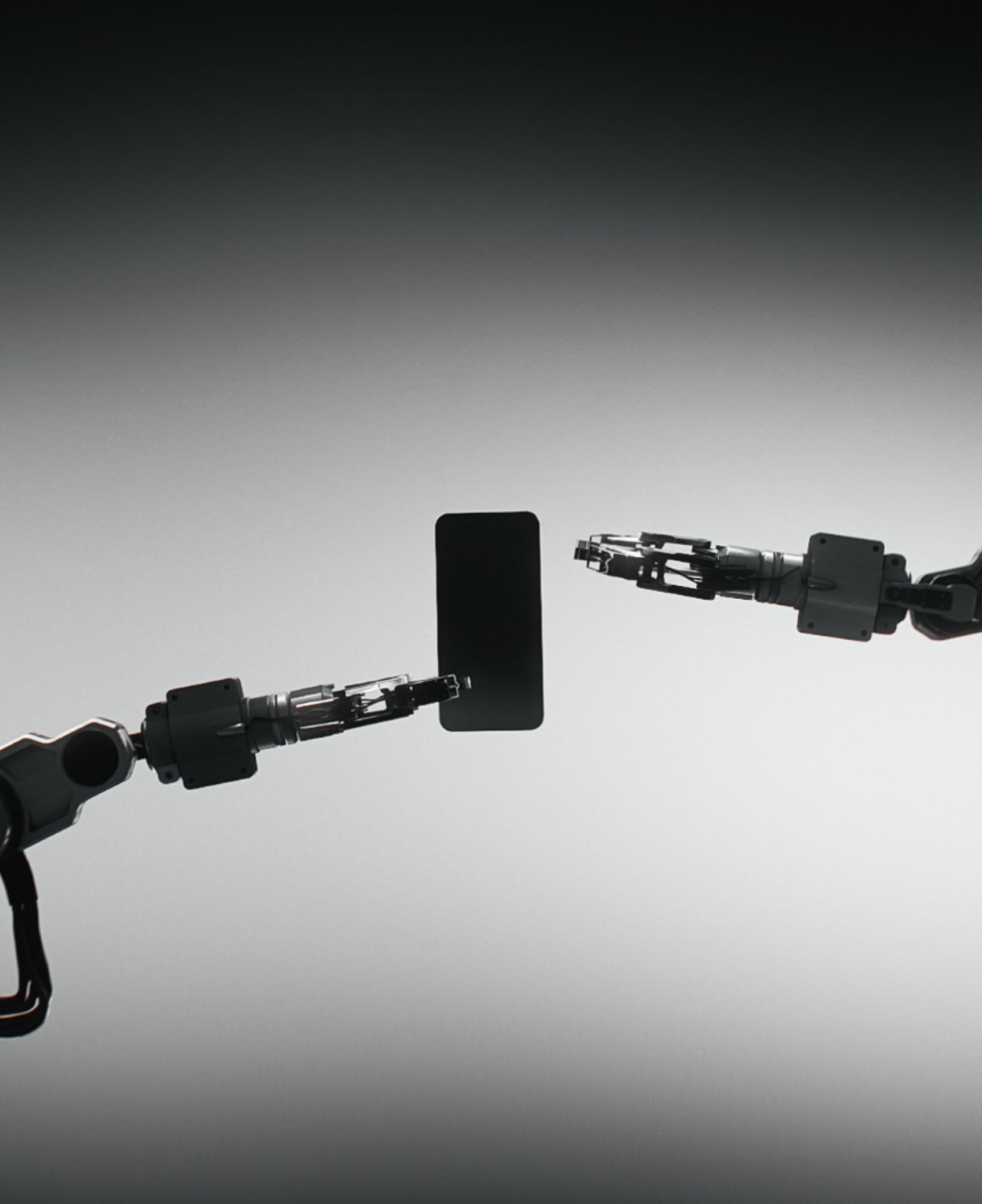 Two robotic arms holding a compact OnePlus 13s against a grey gradient