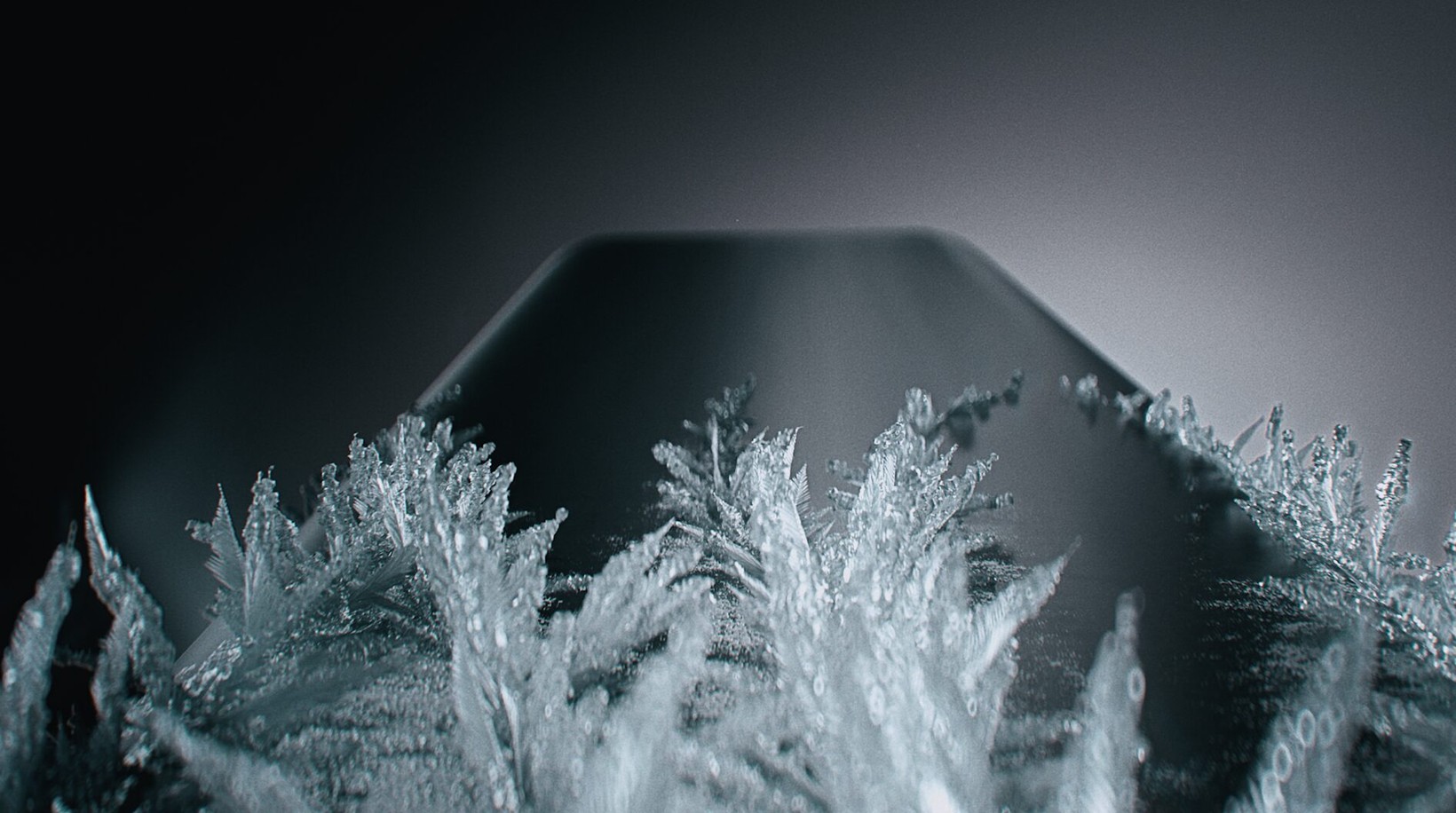 Frost crystals growing over the edge of a phone