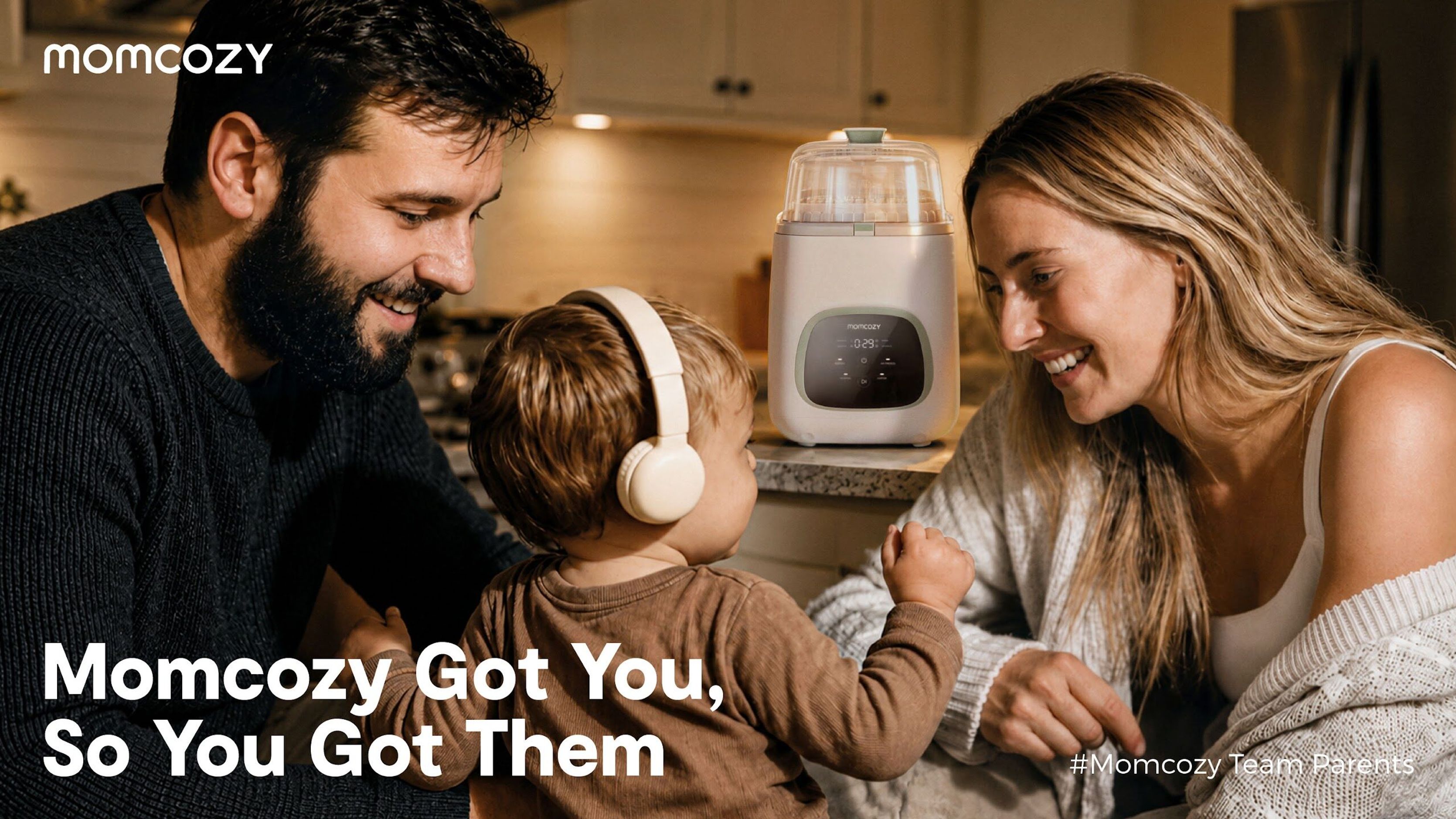 Momcozy key visual of a couple with their child at the kitchen counter