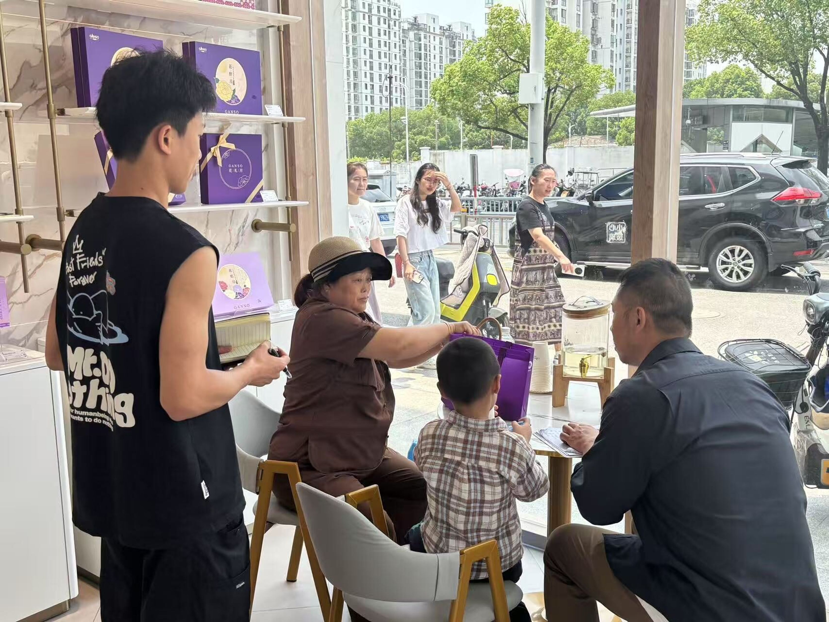 Families seated in a GANSO store during retail immersion