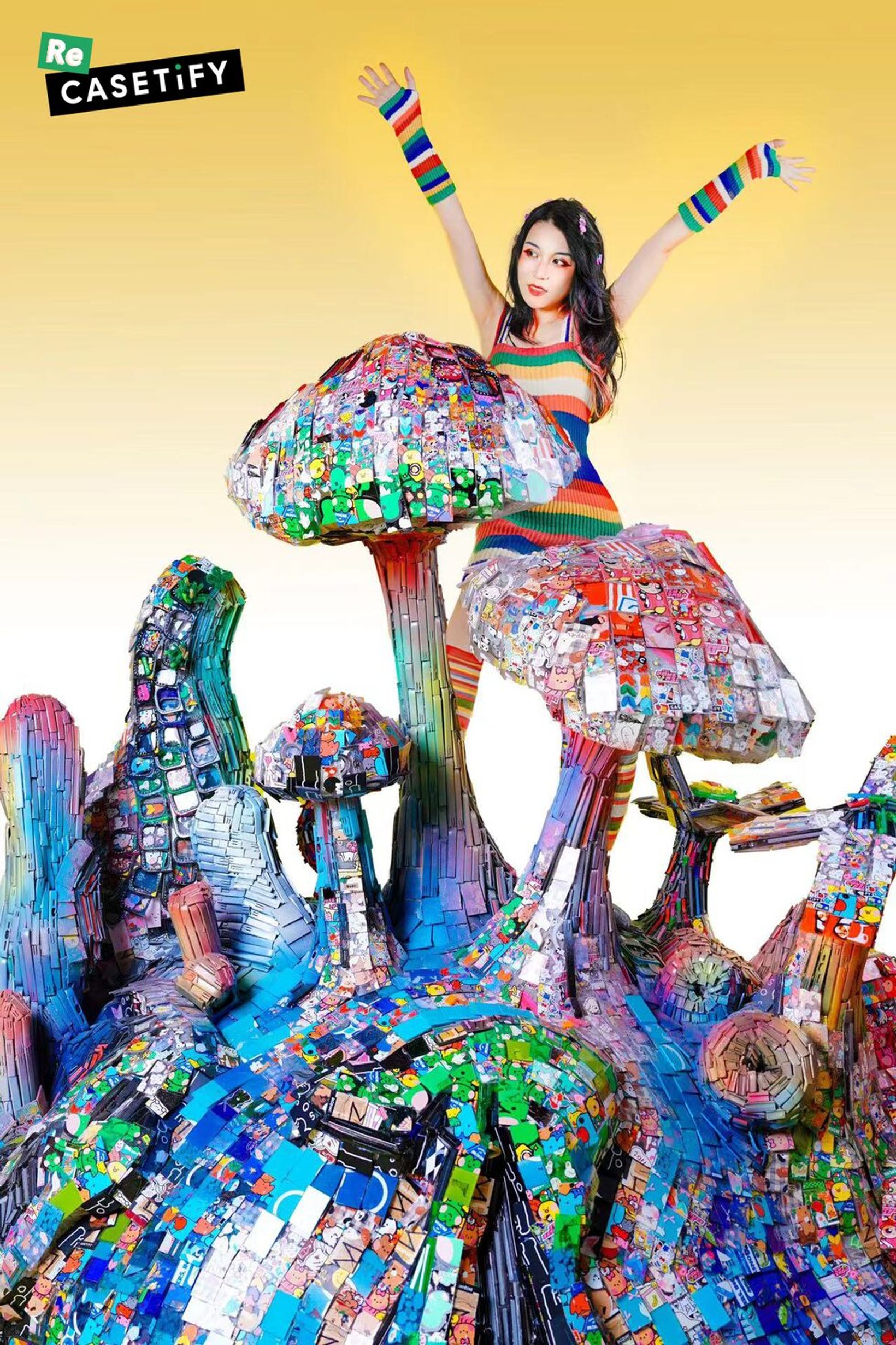 Woman posing on a mushroom sculpture made from recycled phone cases