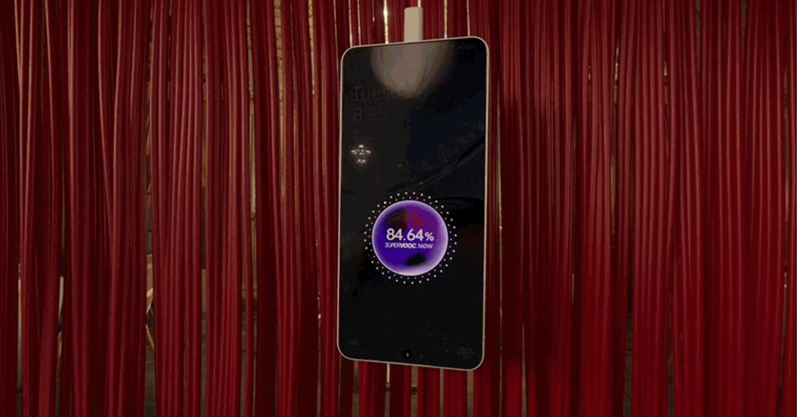 OnePlus Nord 4 floating in front of a red velvet curtain