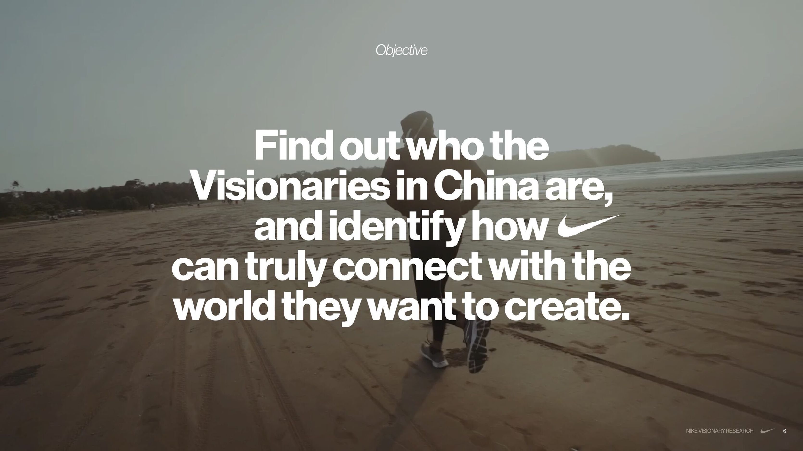 Research objective slide over a figure walking on a beach