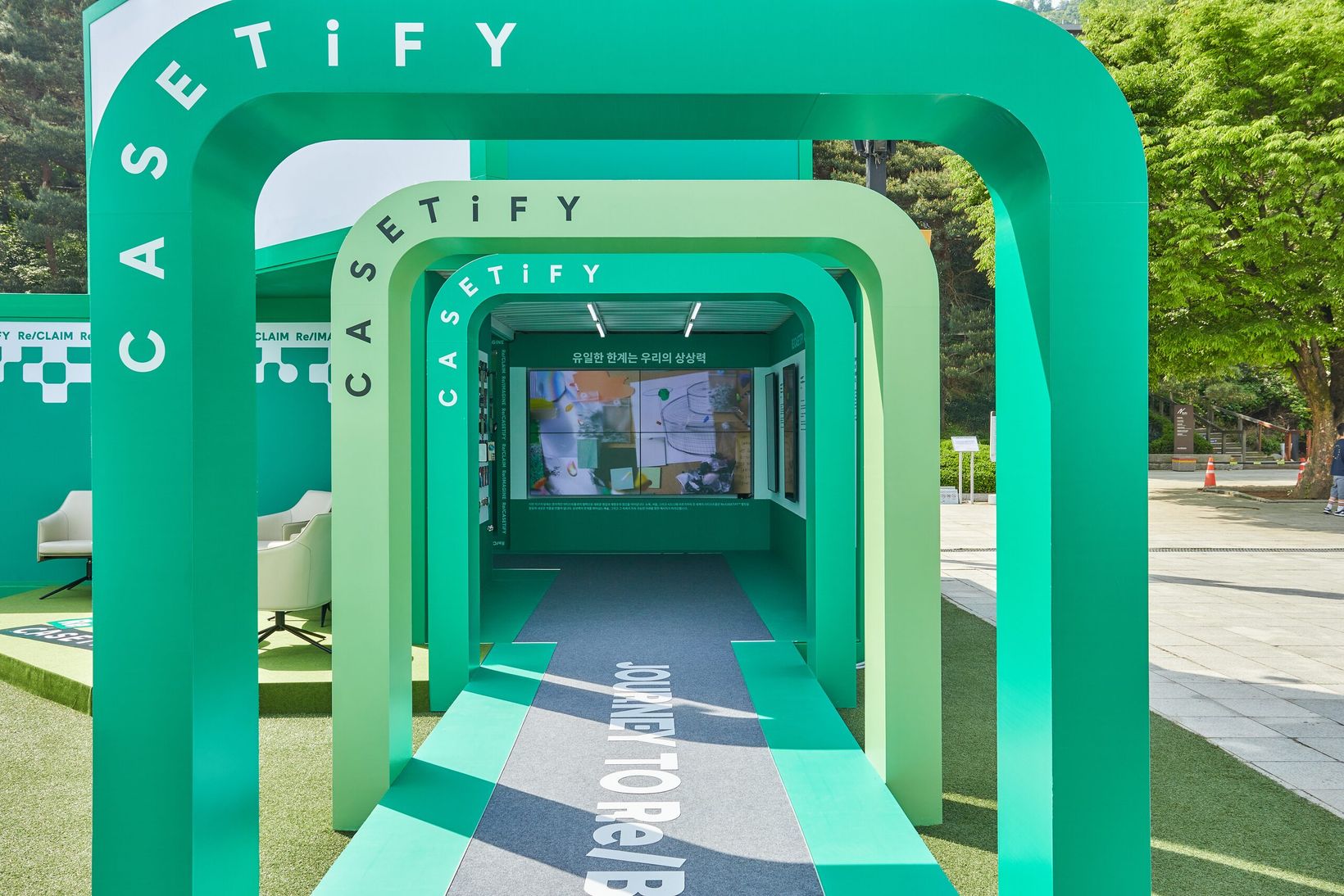 Green CASETiFY-branded tunnel entrance at the Seoul exhibition
