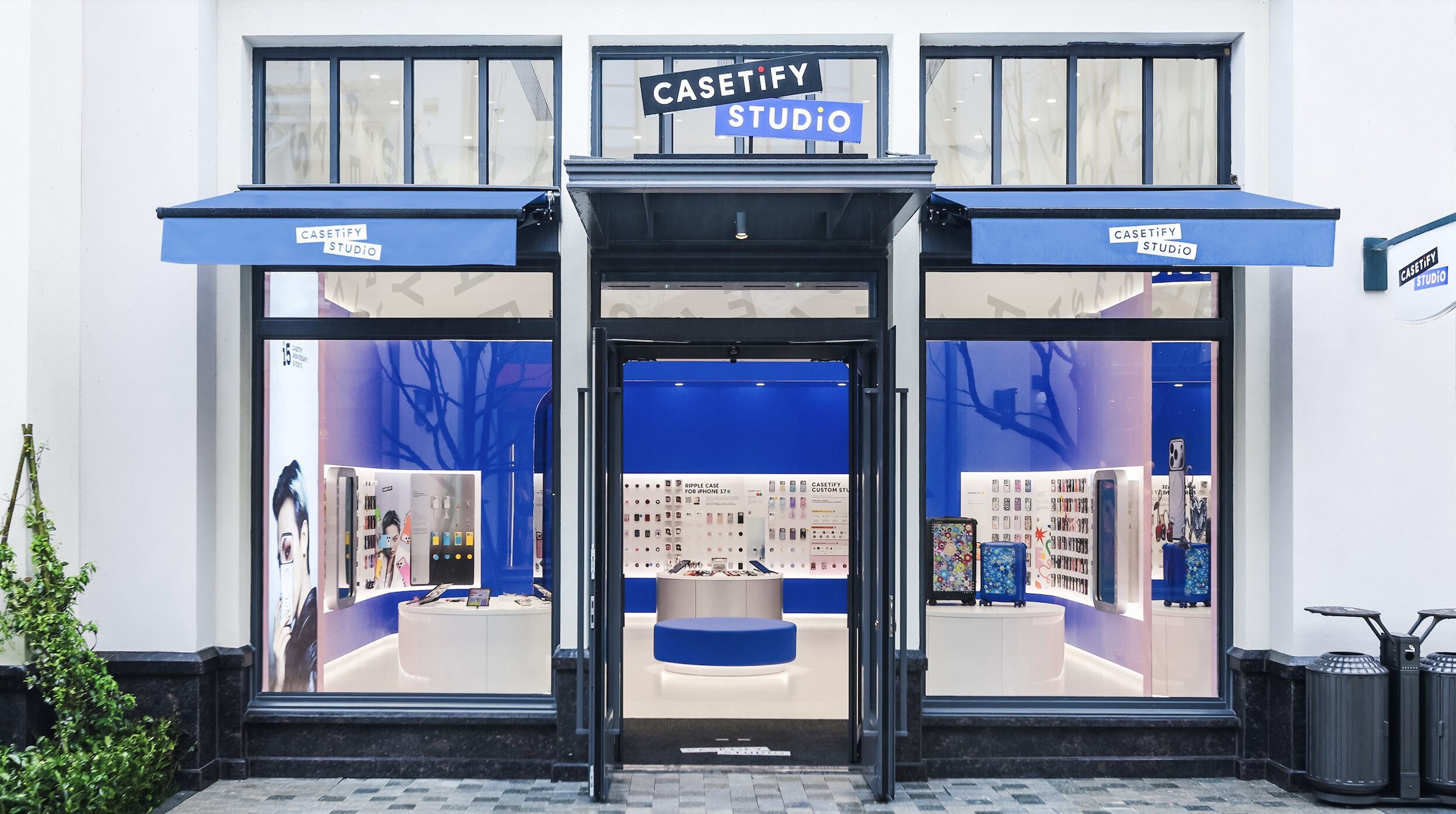 CASETiFY Studio storefront with blue awnings and glass doors