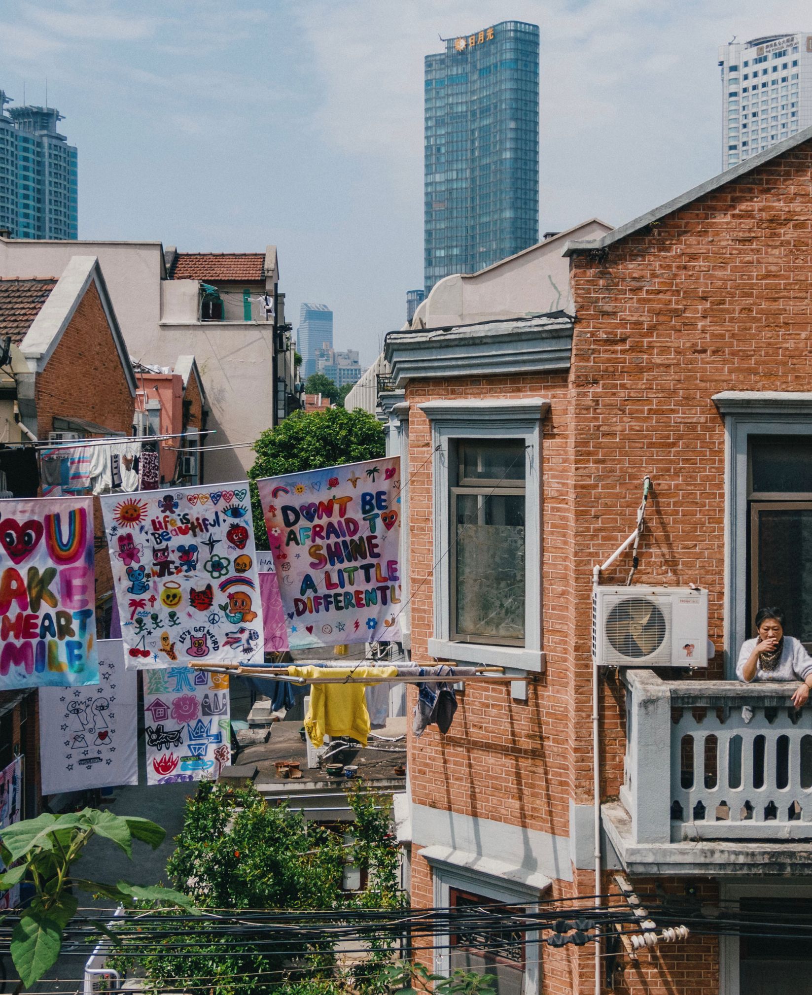 Longtang alley in Shanghai hung with artist-designed sheets