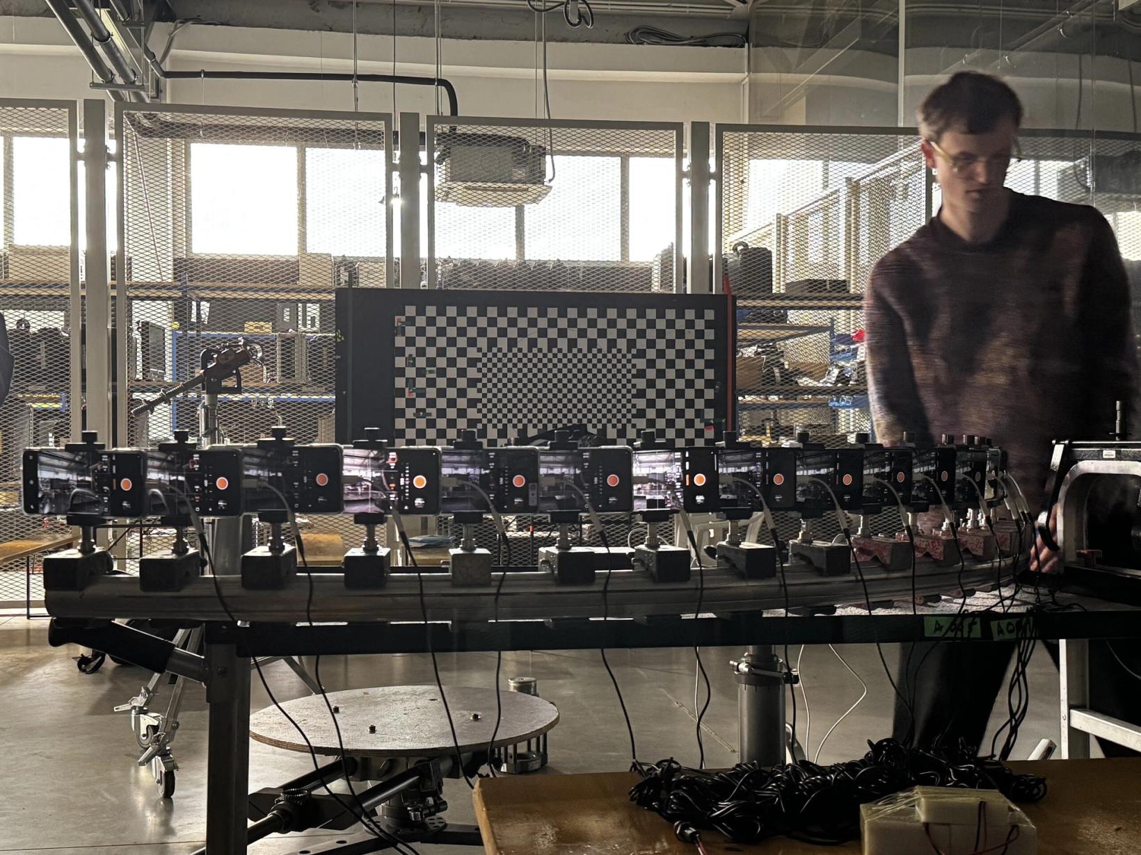 Bullet time rig of OPPO Find X8 phones mounted in a row on set
