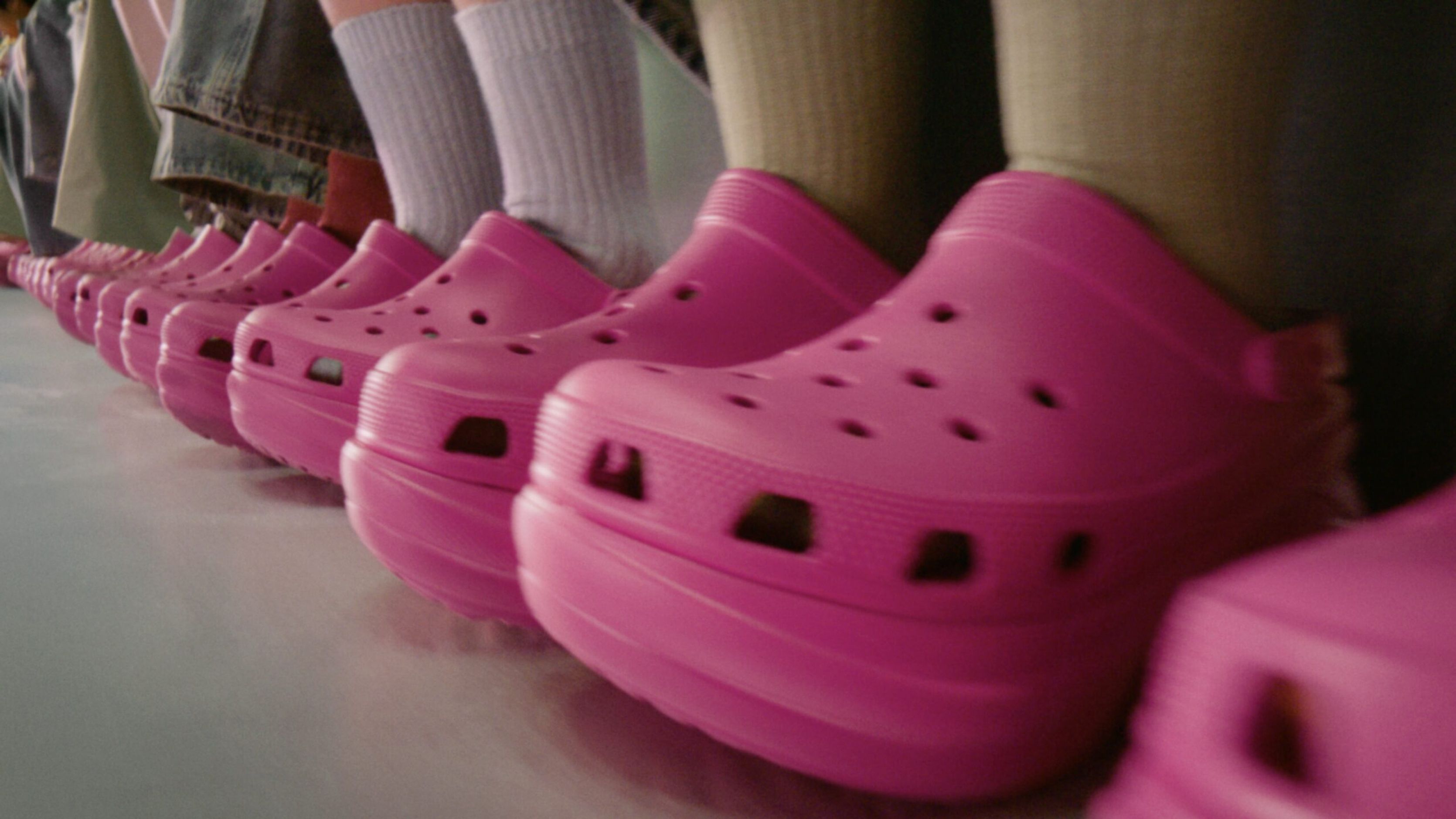 Row of pink Crocs Bae clogs in close-up
