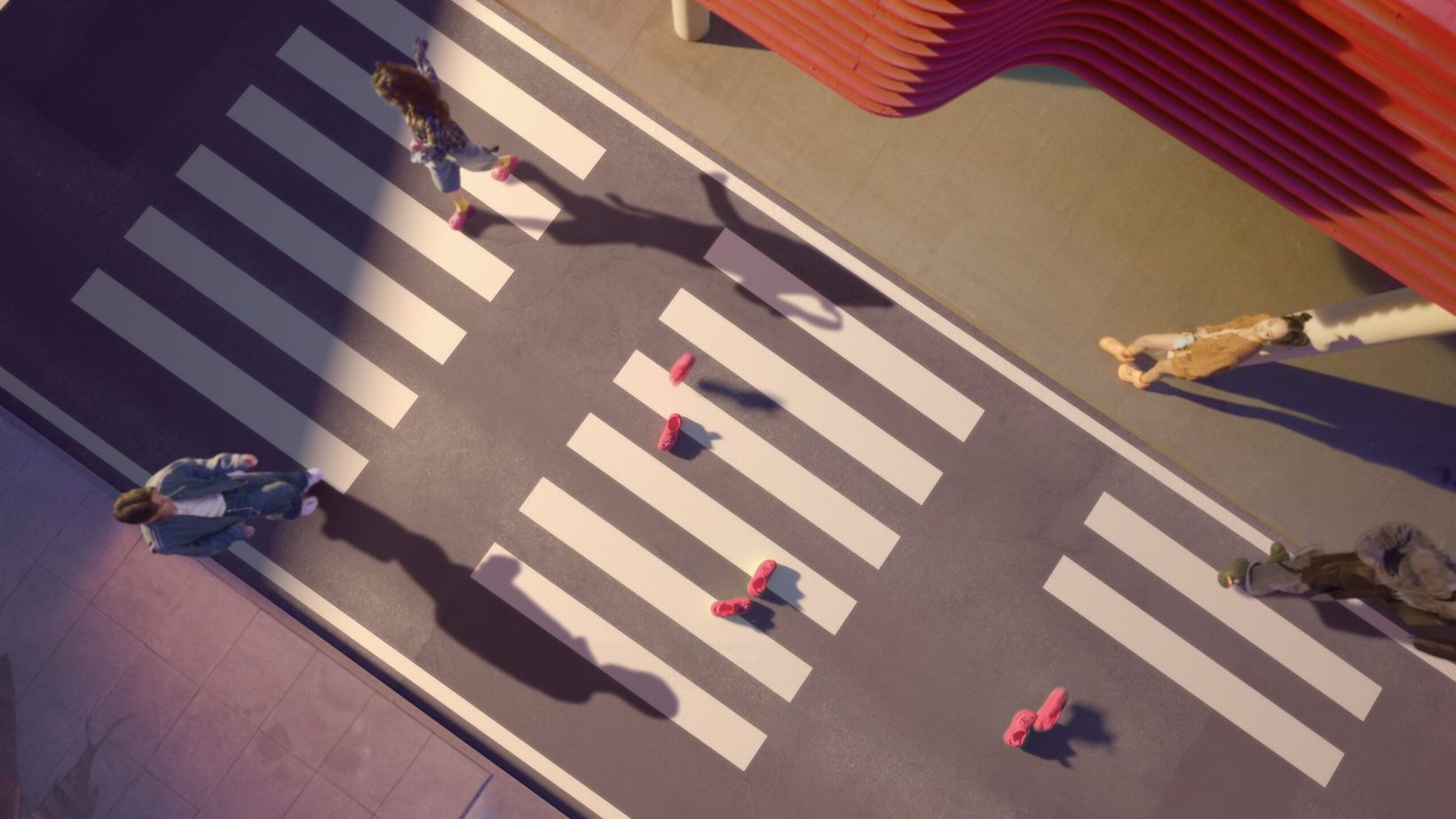 Film still of a crosswalk from above with giant Crocs