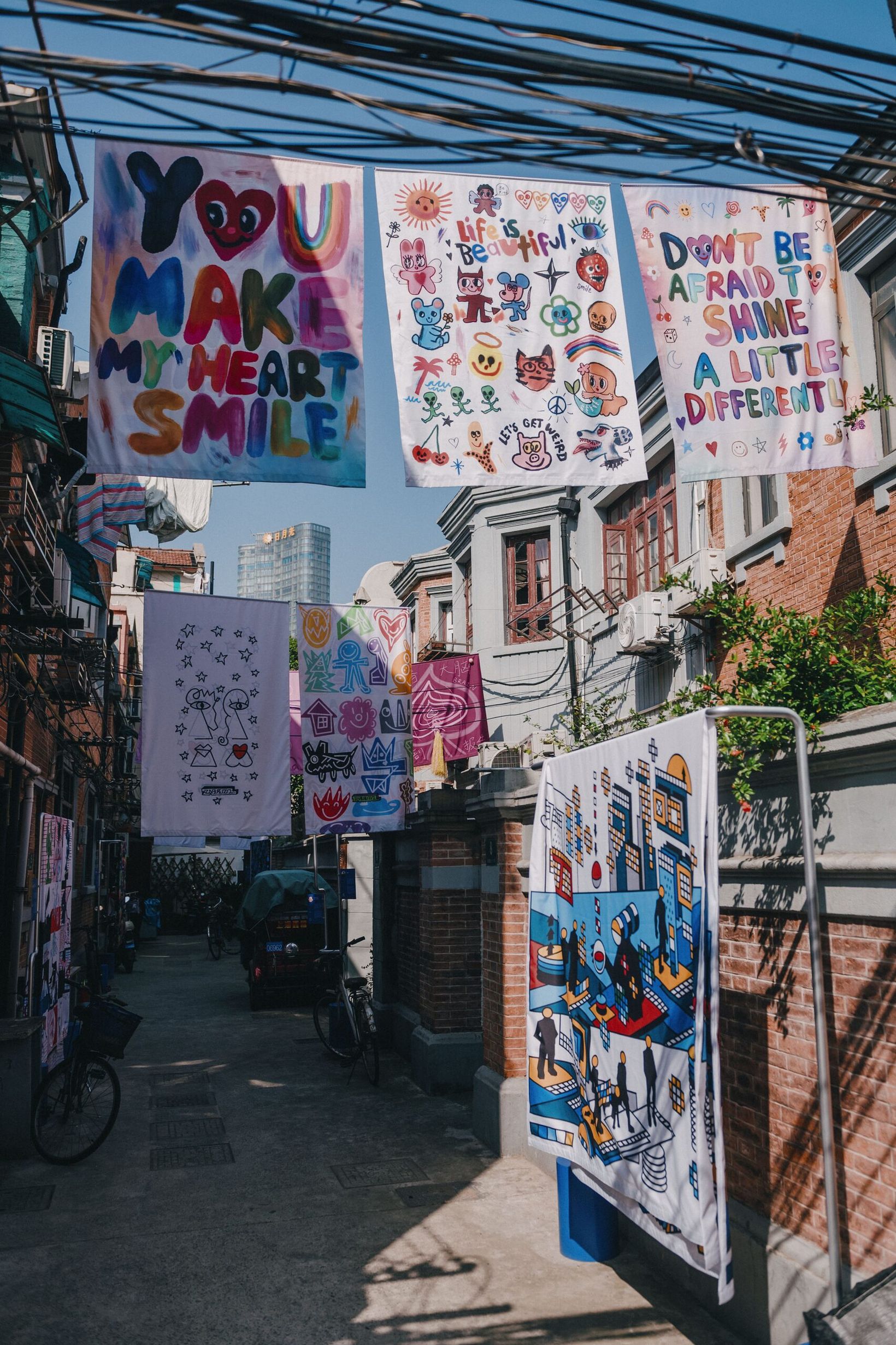 Illustrated sheets reading You make my heart smile hanging over a longtang lane