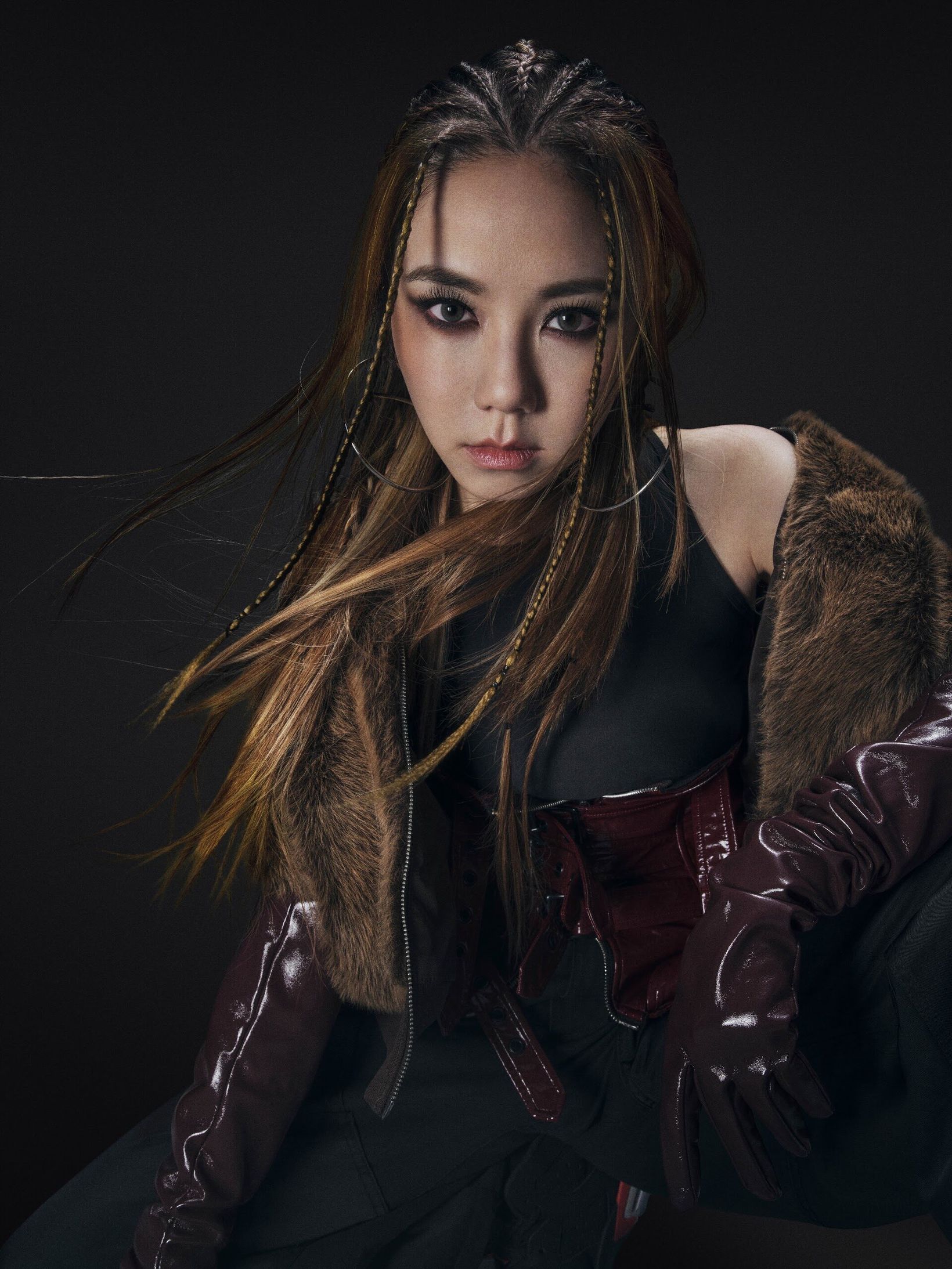 G.E.M. in a fur-trimmed jacket and leather gloves