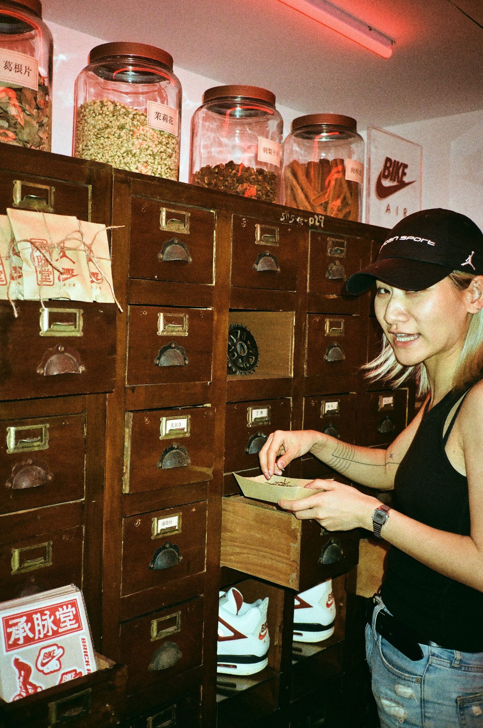 Visitor opening drawers of the interactive medicine cabinet