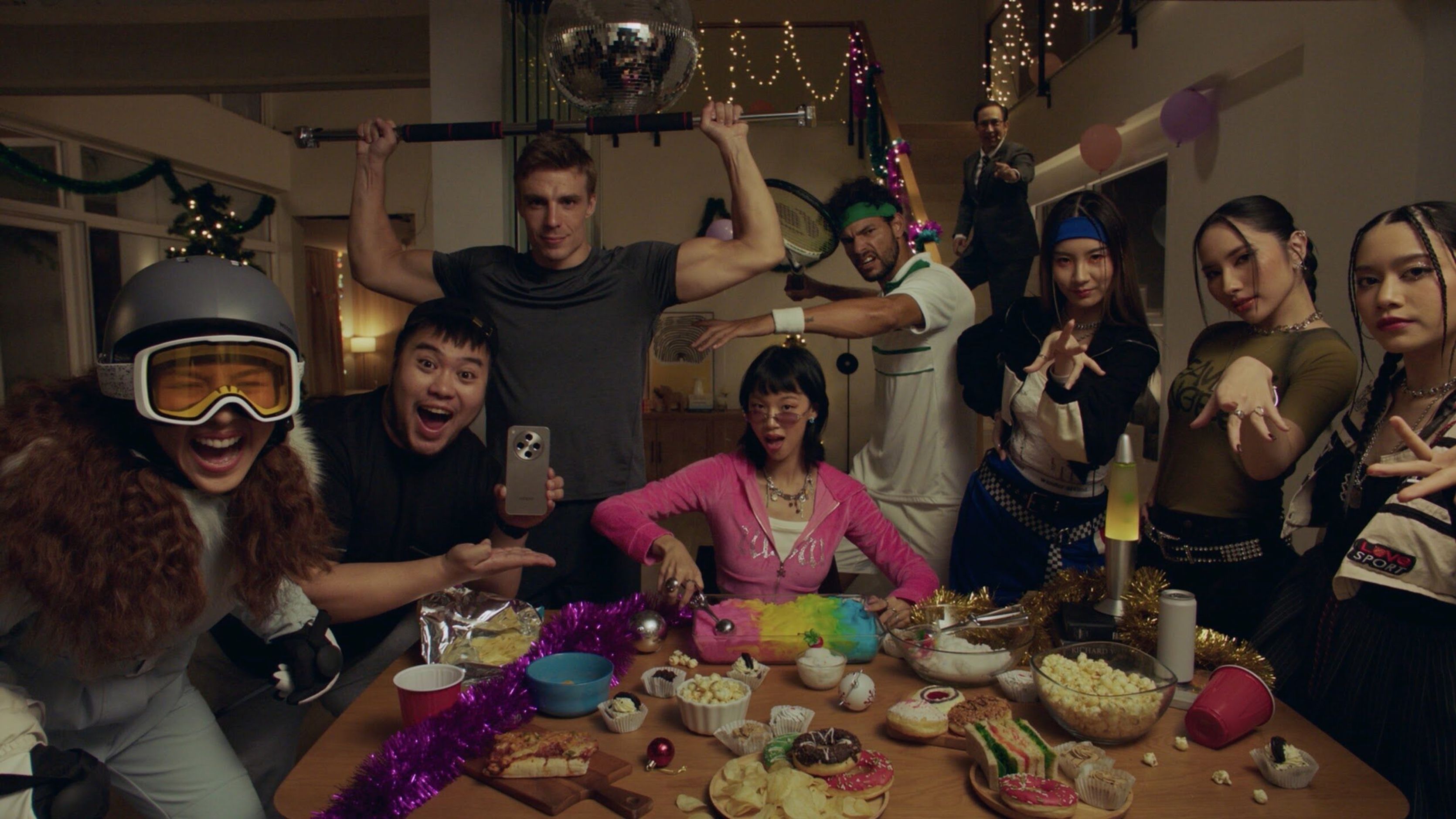 Film still of feed characters crowding a holiday dinner table
